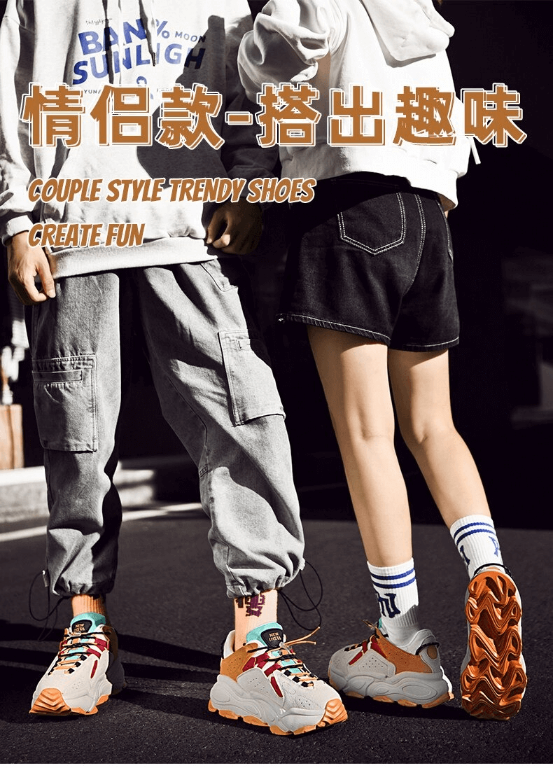 Couple wearing stylish streetwear and trendy sneakers with orange soles, showcasing fashion-forward outdoor walking shoes.